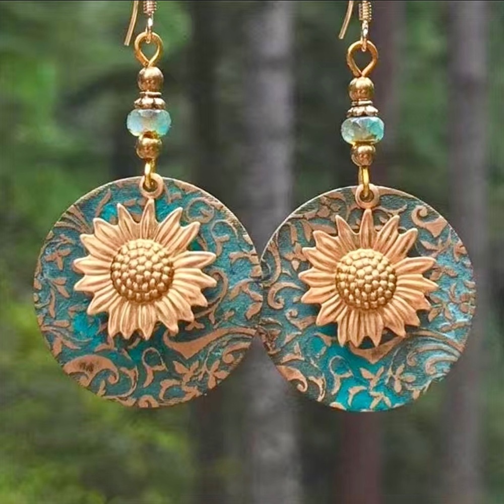 Sunflower earrings, NIP, metal disc 2 3/4” x 1 1/4” Patina finish, well made